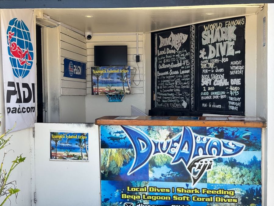 Dive centre interior with schedules and local dive information at Warwick Fiji Resort and Spa in Korolevu.