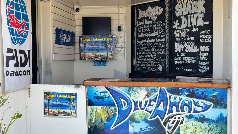 Dive centre interior with schedules and local dive information at Warwick Fiji Resort and Spa in Korolevu.