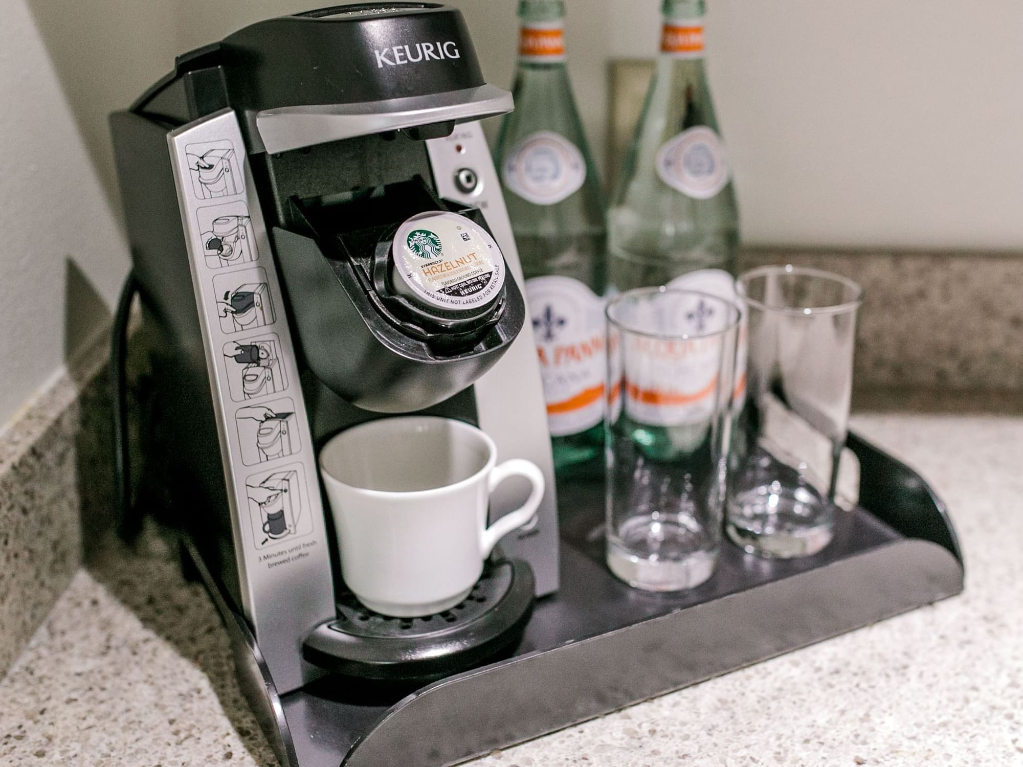 Keurig Coffe System with kcup, coffee mug, and water
