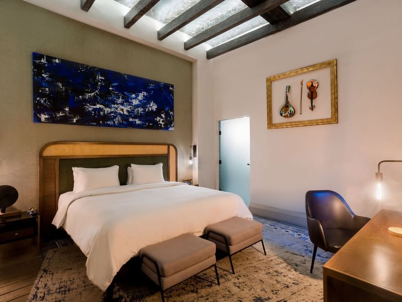 Bed & work desk in Deluxe King at Fiesta Americana Travelty
