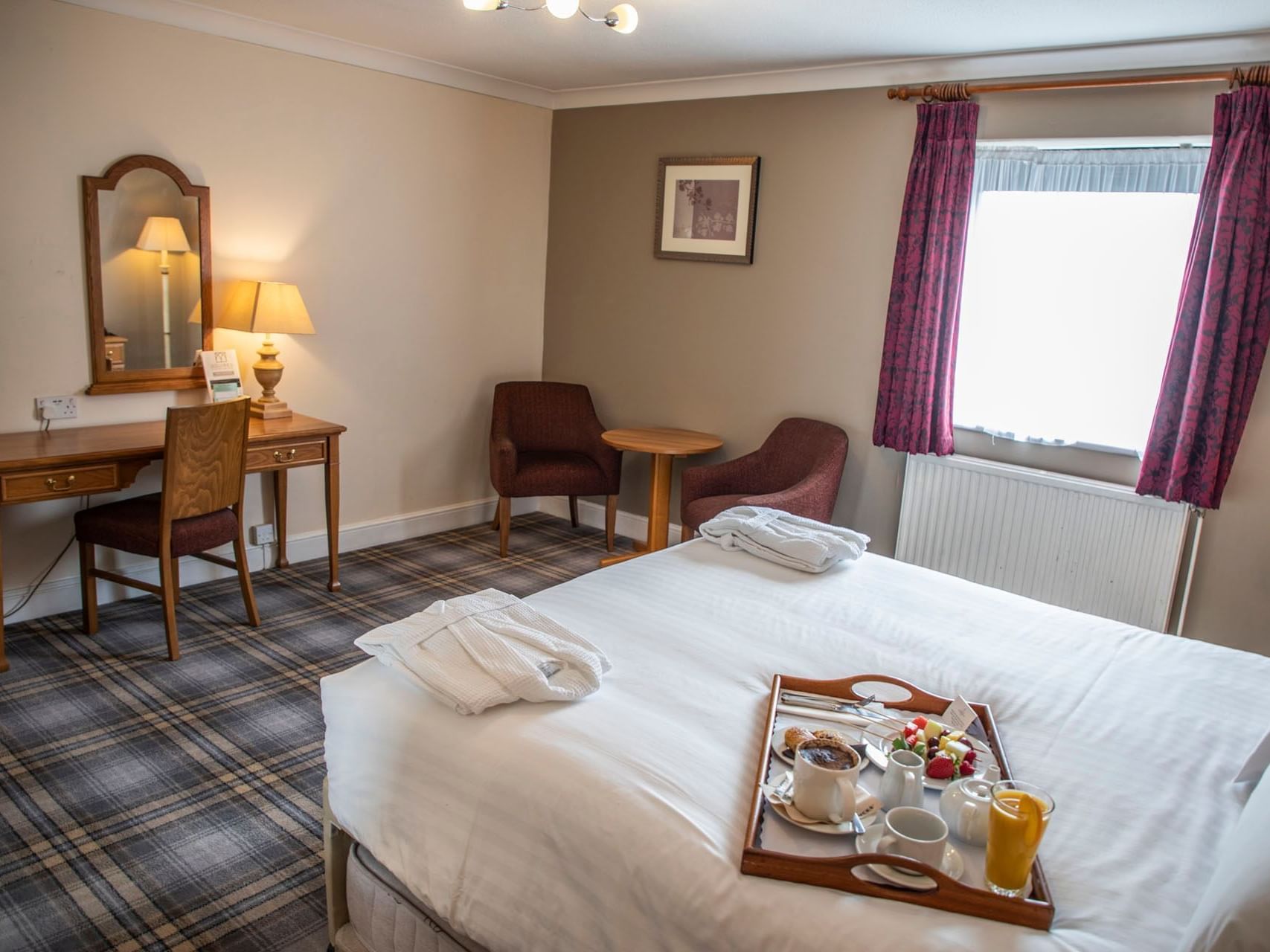 Breakfast on the bed in Superior Room at Bridgewood Manor Hotel