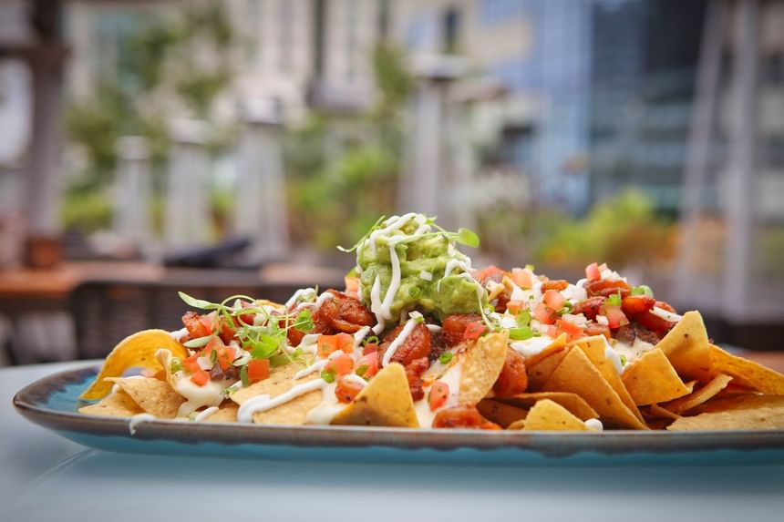 Close-up of nachos served in Topside Terrace Kitchen & Bar at Hotel Republic San Diego