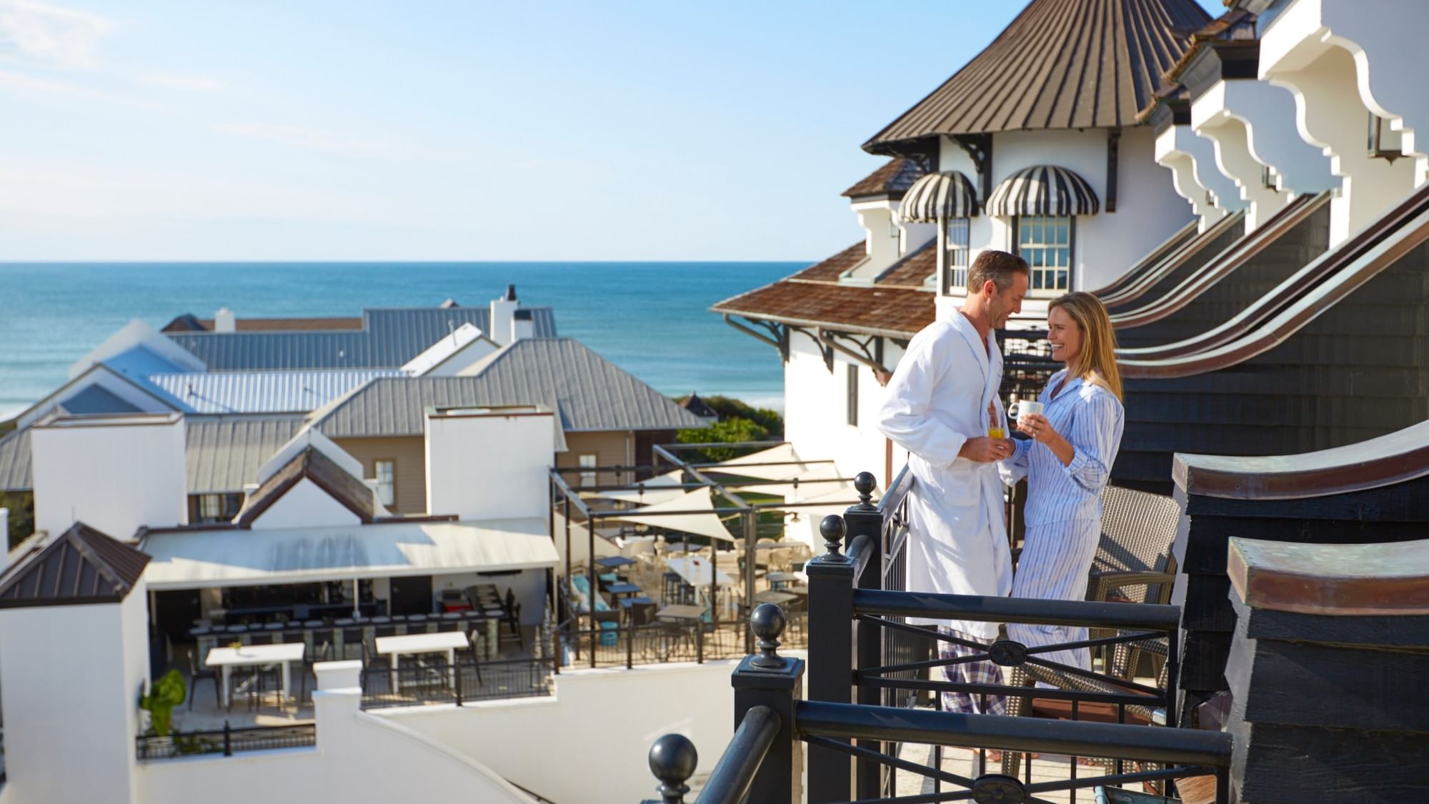 Couple Enjoying Balcony Views at The Pearl Hotel
