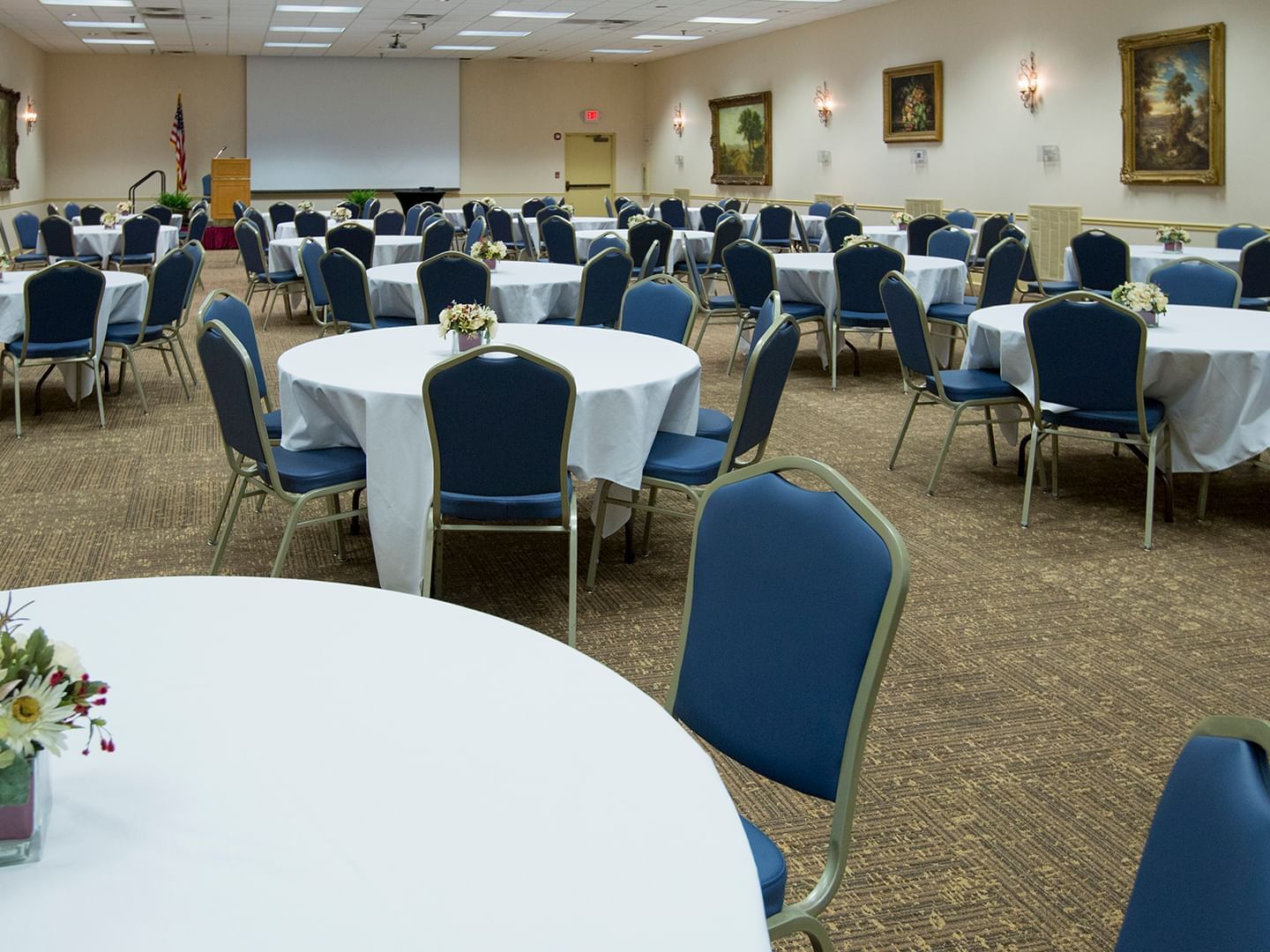 Round banquet tables arranged in a Hall at Music Road Resort