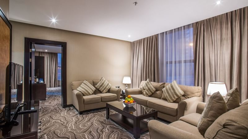Executive Sea Suite living area with comfy sofas and carpeted floor at Warwick Al Khobar