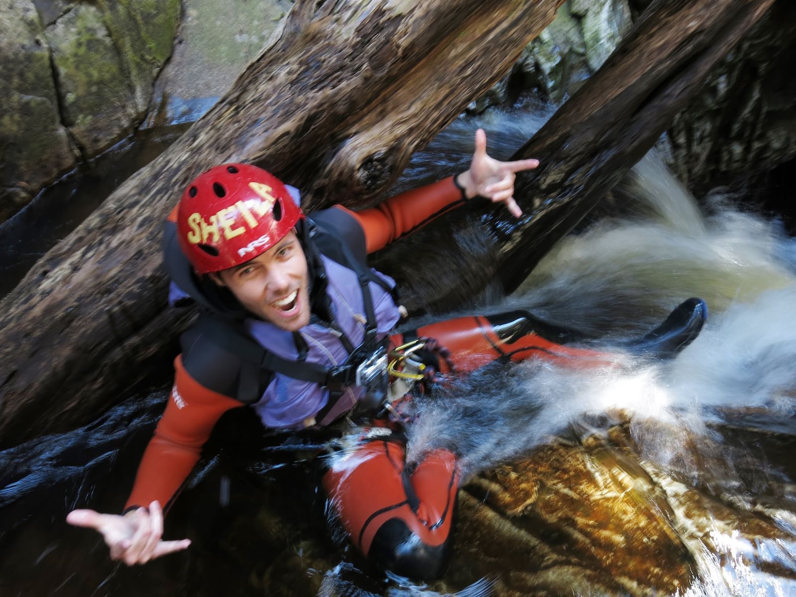 Man on adventure activities in water near Cradle Mountain hotel