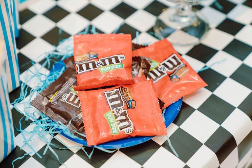 Close-up of a vibrant blue plate holding fun-size M&M's at Park Hyatt Saigon