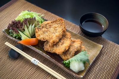 Crispy Oroshi Hire Katsu beef cutlet with grated radish on a woven mat at The Saujana Hotel Kuala Lumpur