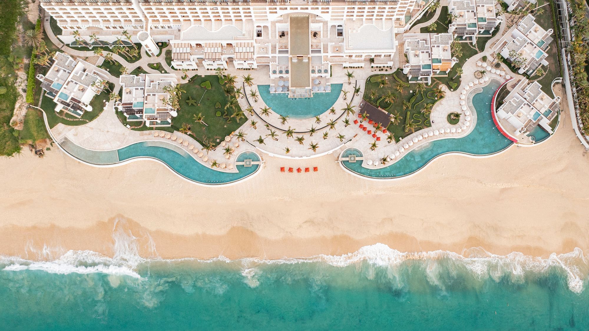 Aerial view of Marquis Los Cabos Resort, showcasing its grand pools and extensive beachfront