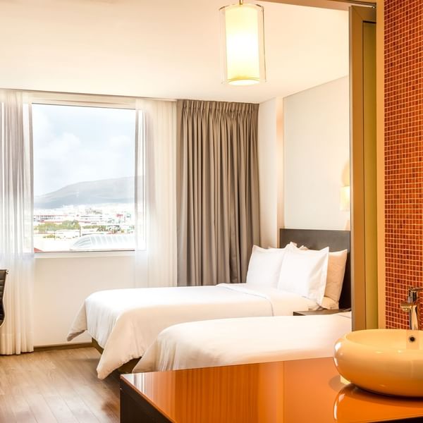 Interior of Superior Room with double beds at Fiesta Inn