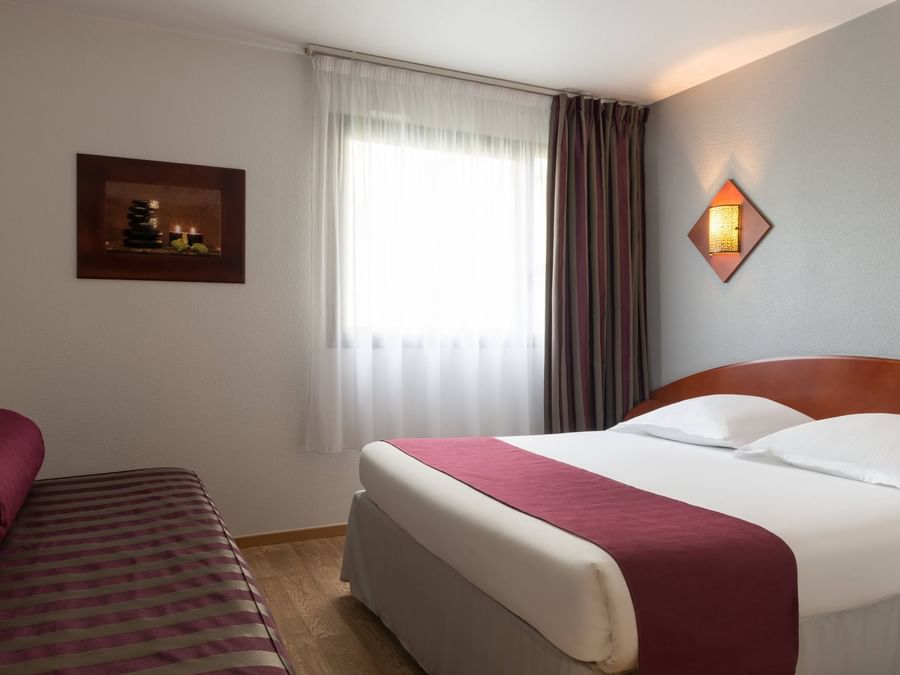 Triple Bedroom with single & king beds at The Originals Hotels