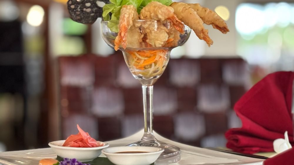Shrimp dish on a platter with sauces and garnishes at Wild Ginger Restaurant & Bar, Warwick Le Lagon - Vanuatu, Efate.