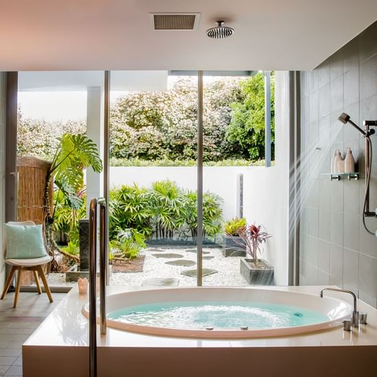 Bathtub with shower in Vie Spa Magenta at Pullman Magenta Shores