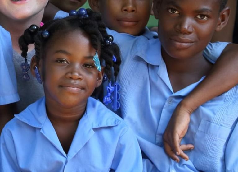 small group of children posing for picture