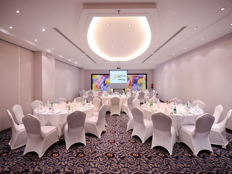 Banquet set-up with projector screen in Crystal 2 at Al Hamra Palace by Warwick Riyadhd