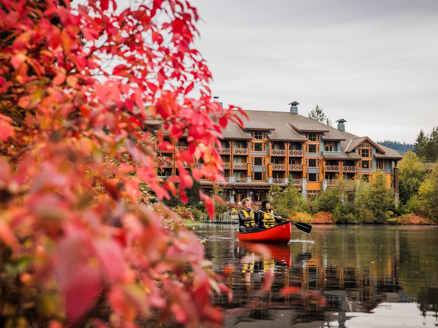 An exterior view of the hotel & lake at Nita Lake Lodge