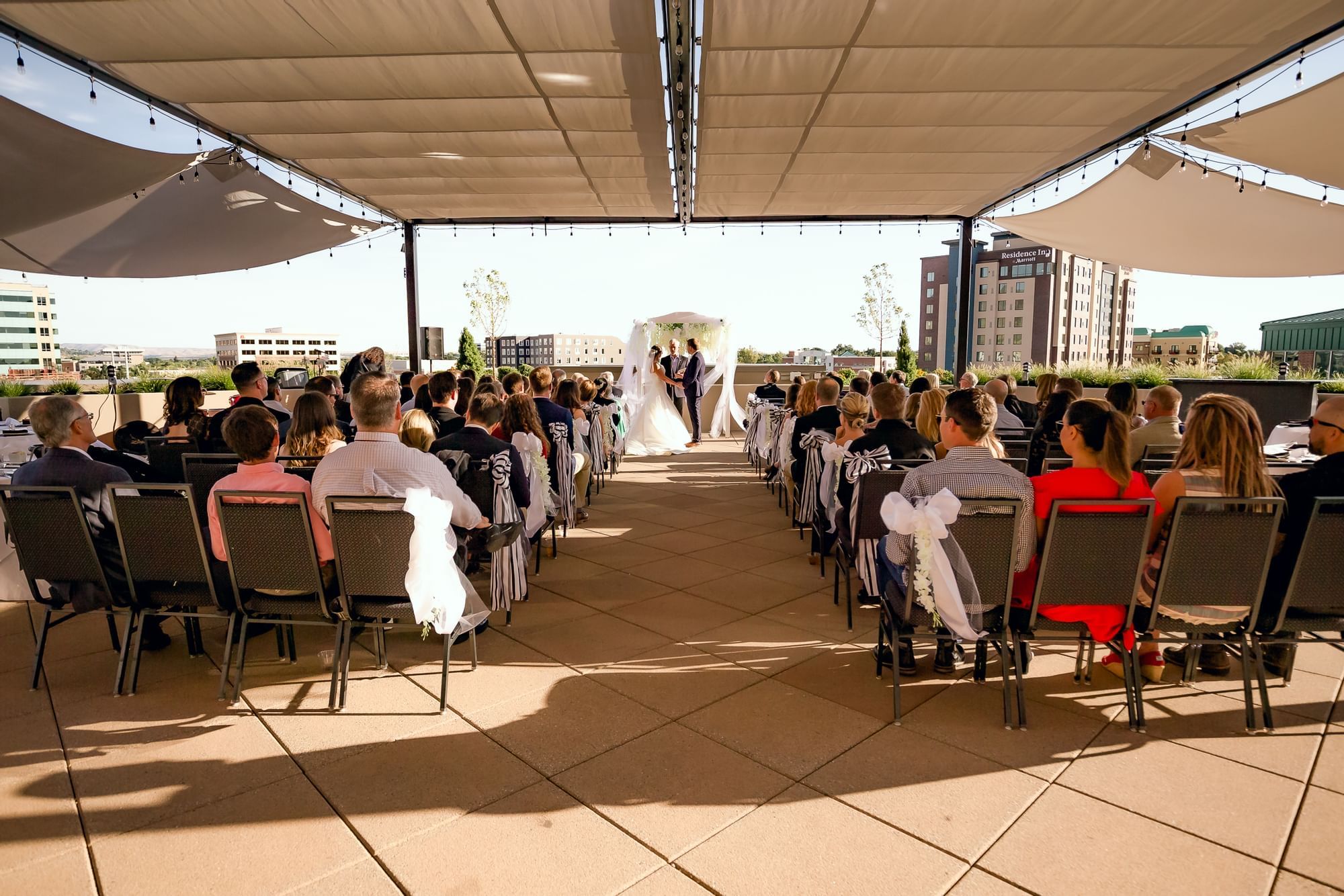 A wedding ceremony on a Terrace at The Grove Hotel