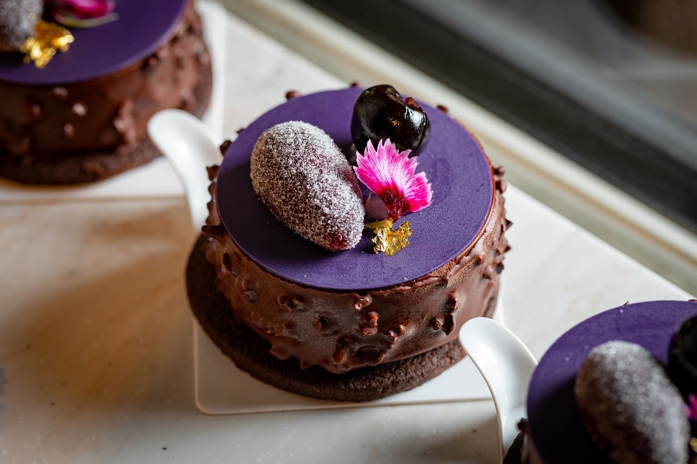 Close-up of an Earl gray chocolate cake served at The Londoner