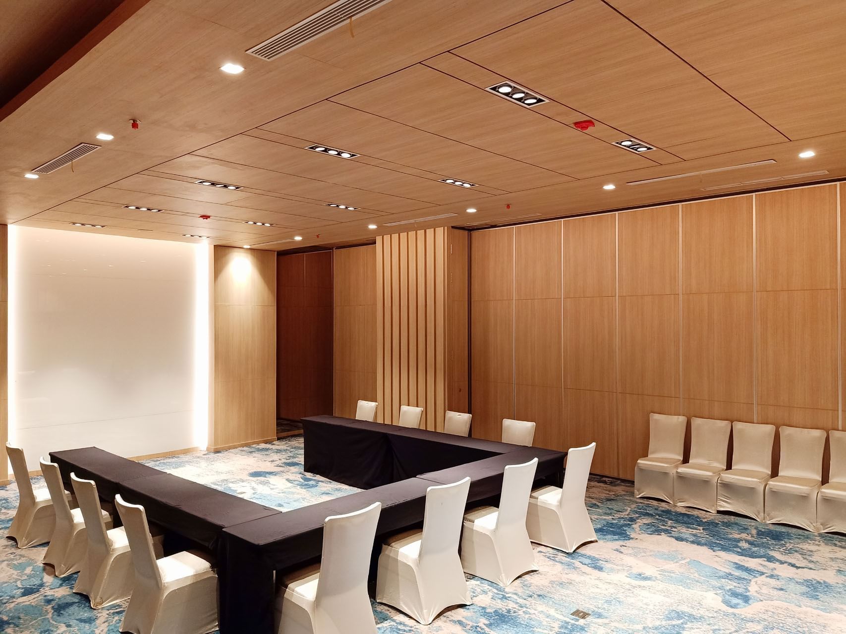 U shaped table set up in Meeting Room 2 with carpeted floors at LK Cikarang Hotel & Residences