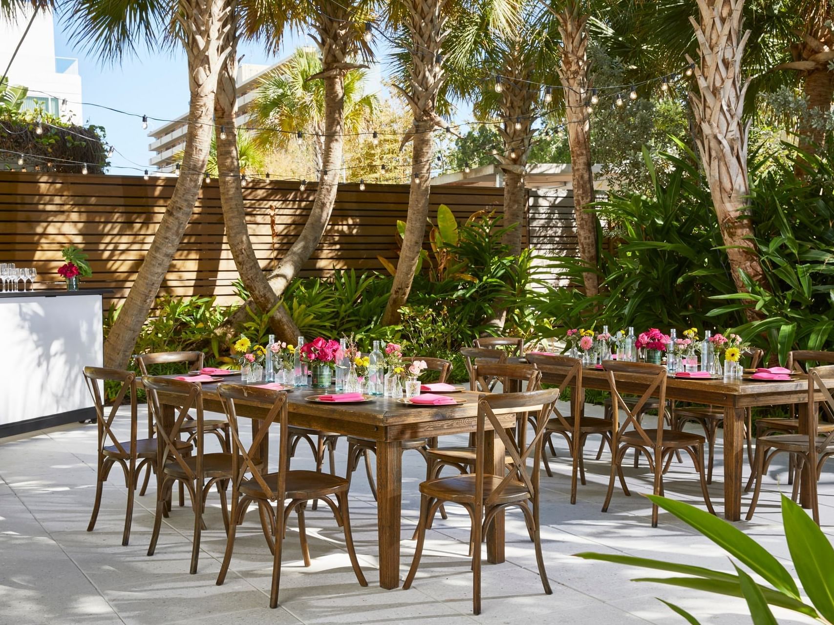 Tables arranged in The Secret Garden at The Sarasota Modern