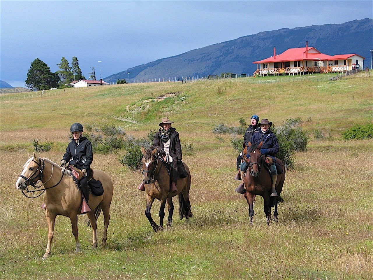 4 men on horses at Sofia Lake Horseback Ride near NOI Indigo 