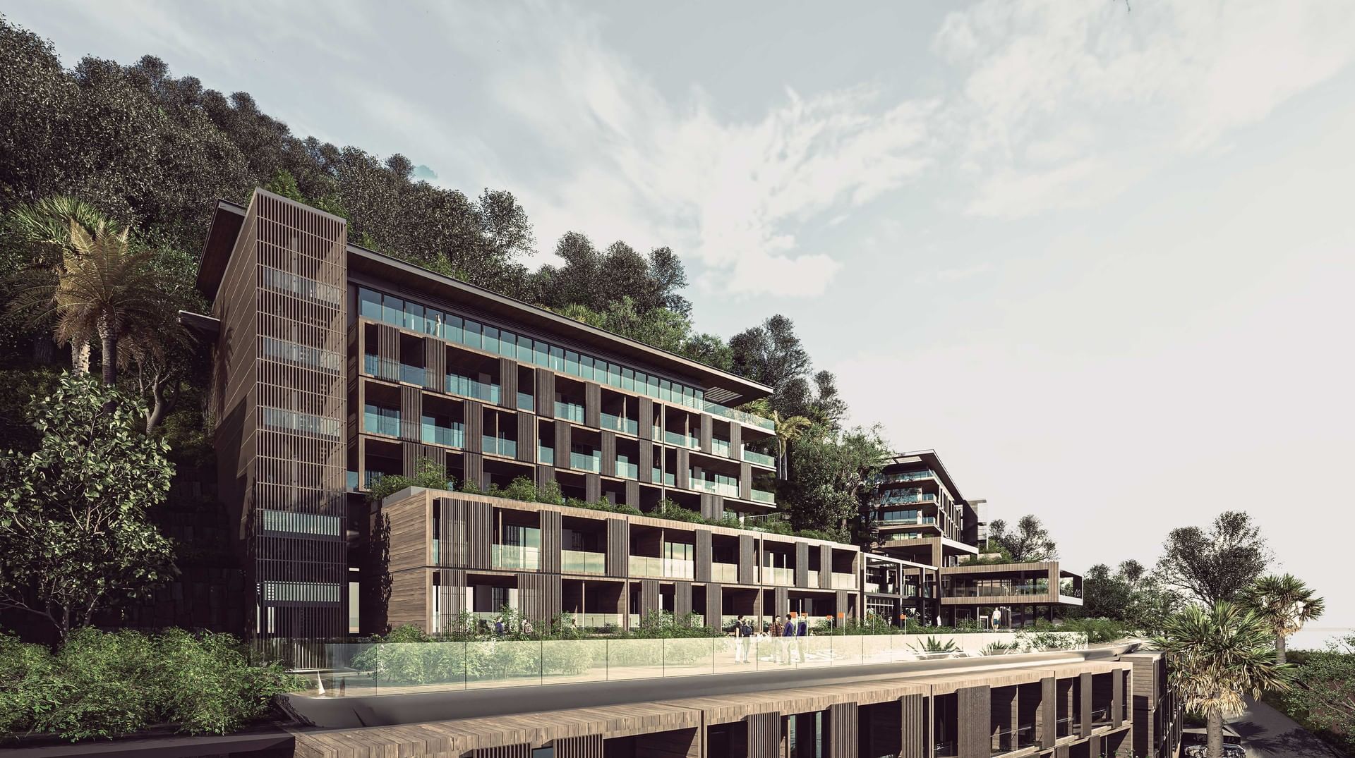 Stylish modern Sunset Residence at A’ila Resorts with wooden facade, large balconies, and stunning hillside views