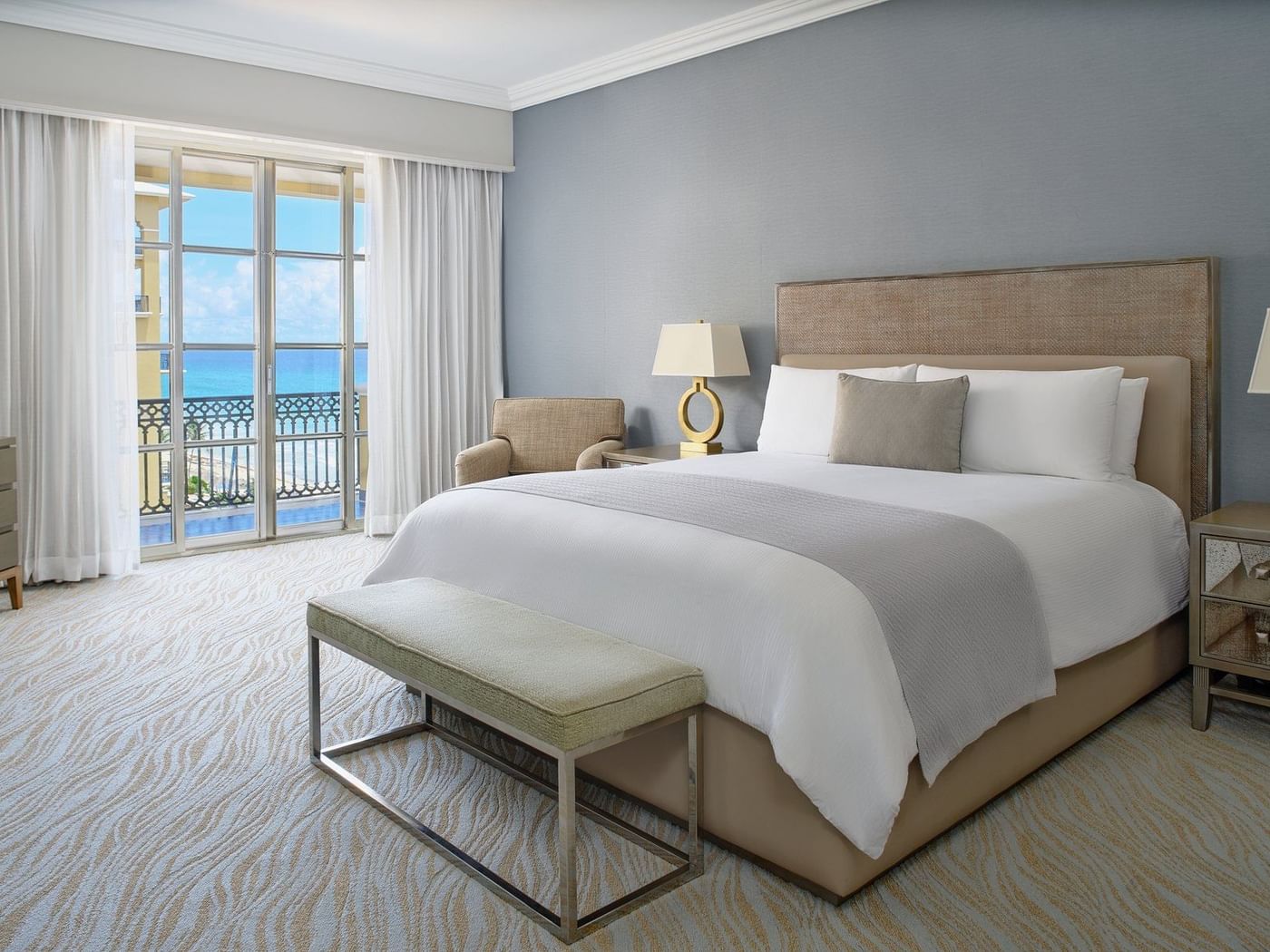 King bed, lounger and cozy bench in Club Seaside Suite at Kempinski Hotel Cancún