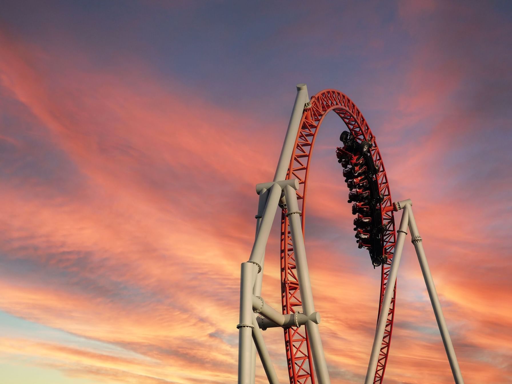 Roller coaster at a theme park with a beautiful istanbul sunset