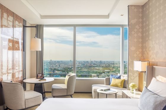 King bed with city view in Premium Deluxe bedroom at Eastin Grand Hotel Phayathai