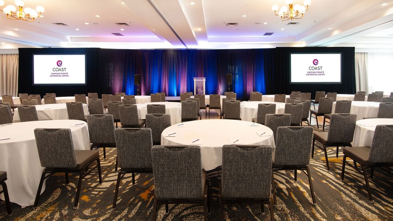 Large conference room with round tables.