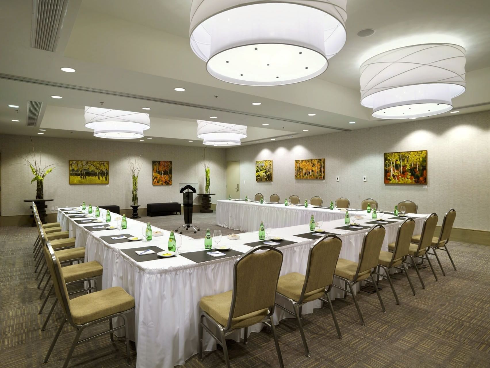 chairs at a u-shaped conference table