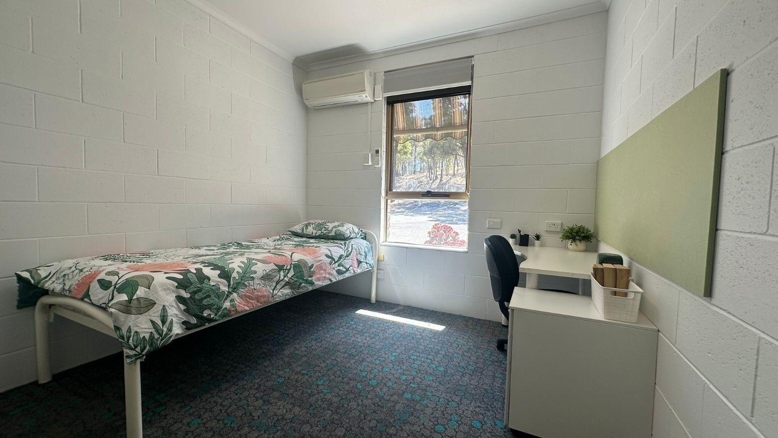 Small room with a single bed and desk at La Trobe University - Orde House.