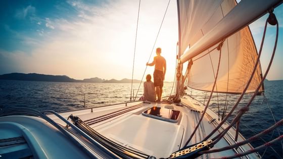 A couple sailing in yacht near Sunseeker Resort