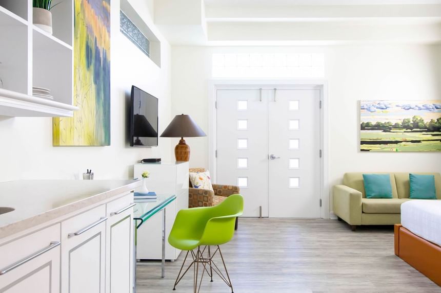 Work desk, TV & comfy sofa in Queen Premiere Spring Fling at Retro Suites Hotel