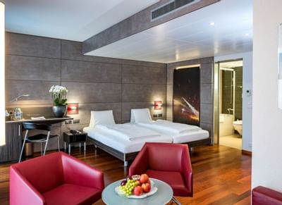 Beds, floating desk & armchairs in Twin Room at Hotel Sternen