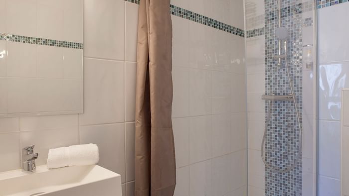 Bathroom vanity in bedrooms at Hotel Novella