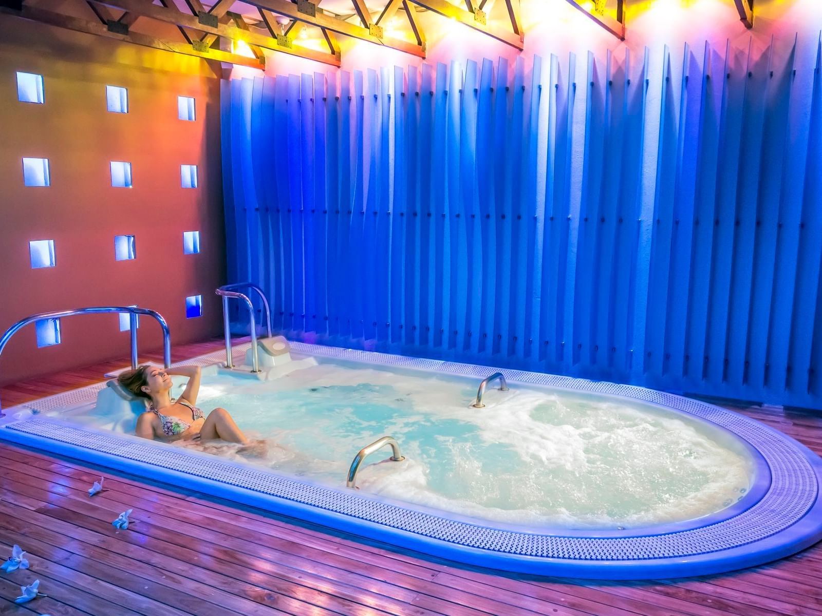 A girl relaxing in Spa deluxe indoor pool at Bogotá Plaza Hotel