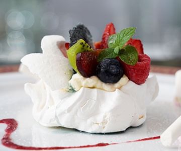 Dessert with berries on top at Hotel Emperador Buenos Aires