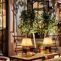 Lamps on tables at the lounge of the La Bodega at Marbella Club