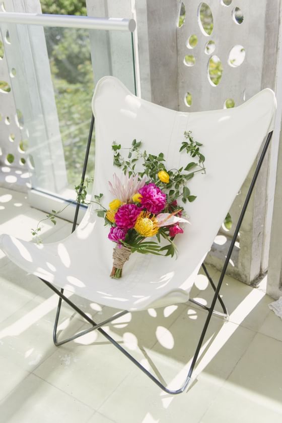 Close up of a Flower Bouquet in a chair at El Blok Hotel  