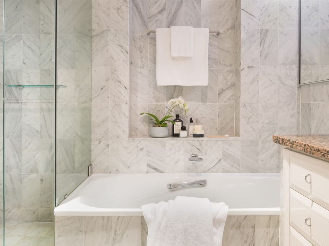 Bathtub & bathroom amenities at Sebel Quay West Suites Sydney