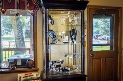 Jewelry display case in the gift shop at The Ranch at Ucross filled with necklaces, rings, and earrings