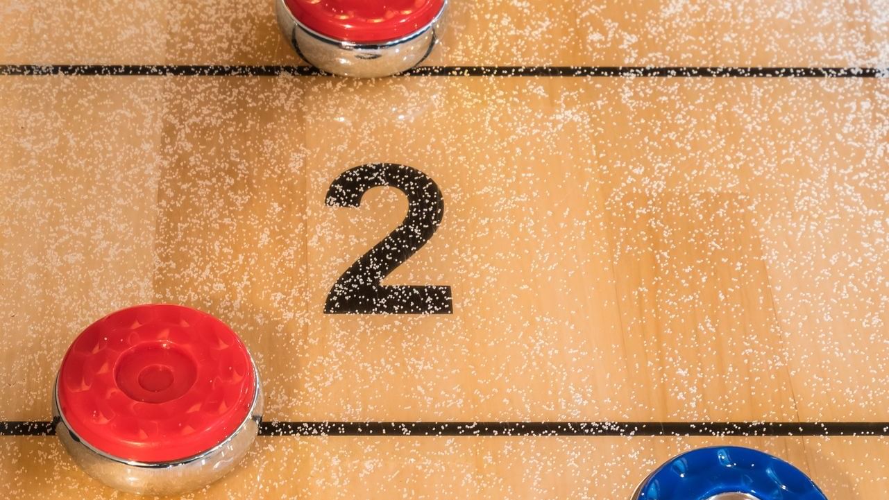 Close-up of pucks on the shuffle board at Cove Pocono Resorts
