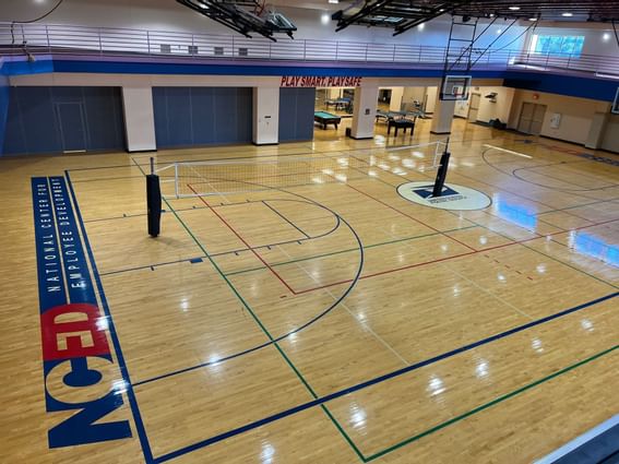 An indoor volleyball court at NCED Hotel and Conference Center