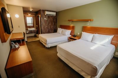 Double beds & TV in Executive room at Araiza Hotel Calafia