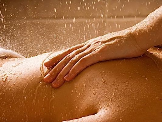 A woman getting an oil massage at Casa Colonial Beach and Spa