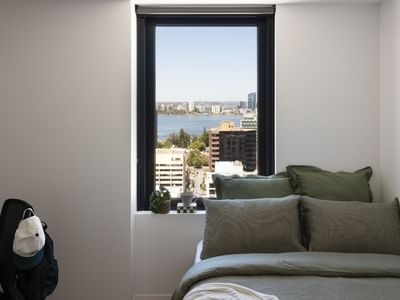 UniLodge Perth Central -  showing bed and view out the window of the studio