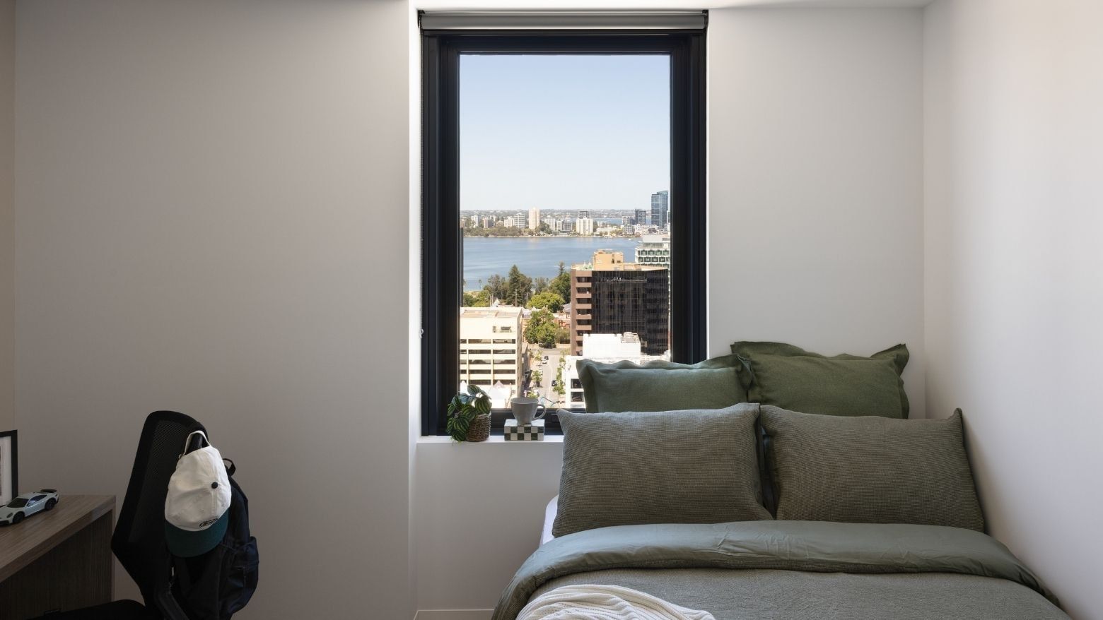 UniLodge Perth Central -  showing bed and view out the window of the studio