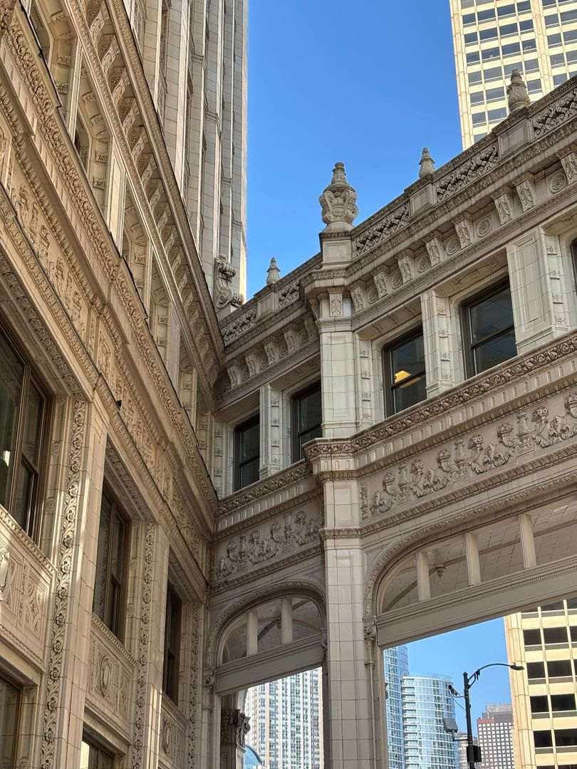 Wrigley Building exterior with detailed stonework and arches near Warwick Allerton Chicago