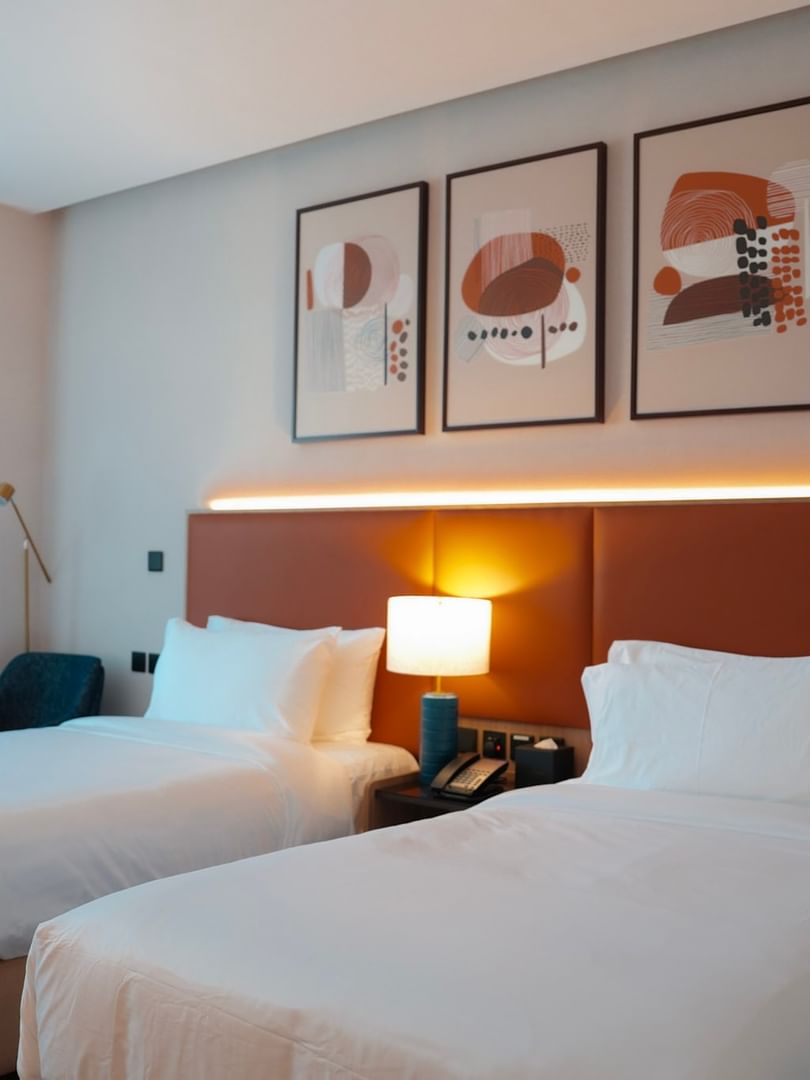 Two comfortable Deluxe Rooms with modern decor and amenities at Warwick Hotel & Spa in Jeddah.